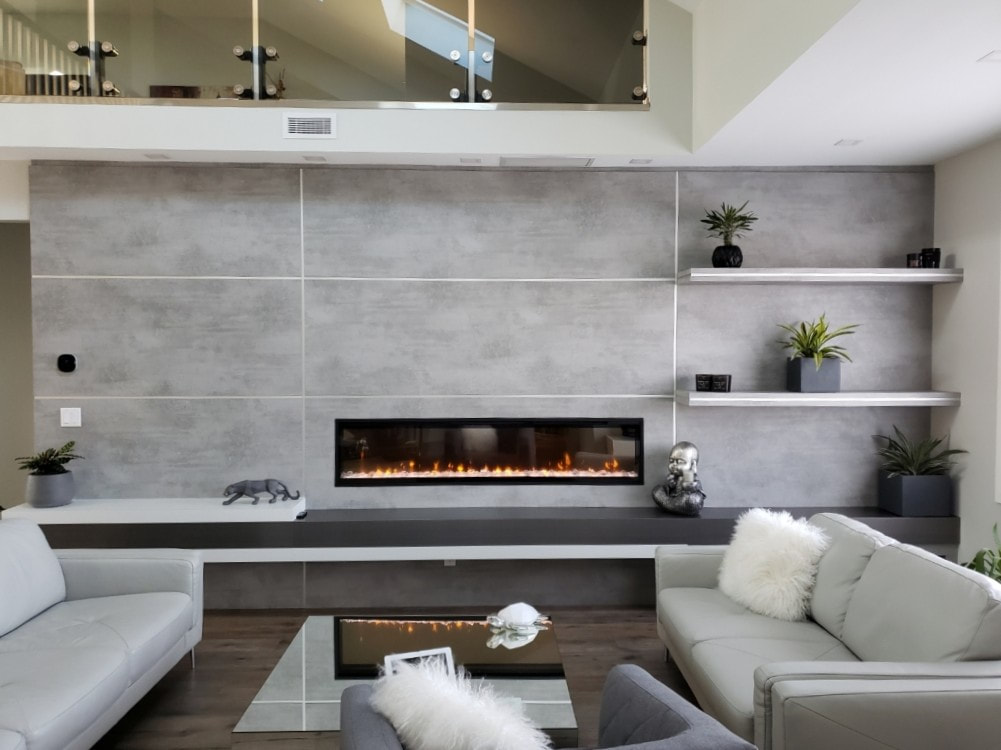 Cement-look wall panels with floating shelves and electric fireplace insert